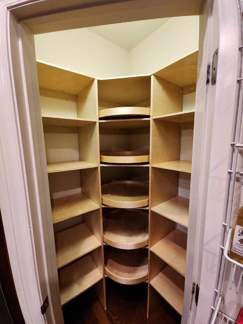 Custom corner pantry with lazy susan shelving